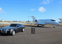 Rolls Royce Ghost on the tarmac with private jet